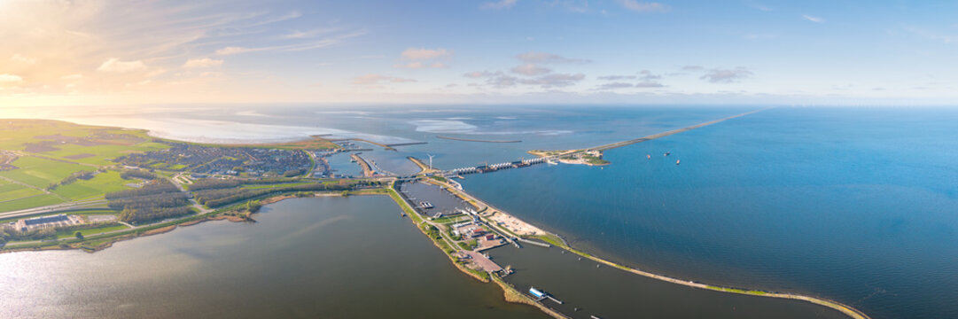 Afsluitdijk coastal dam and sluice complex, aerial panorama