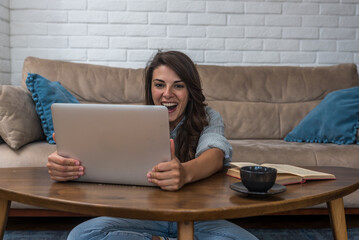 Young intelligent innovative businesswoman presenting her startup new business idea via video call...