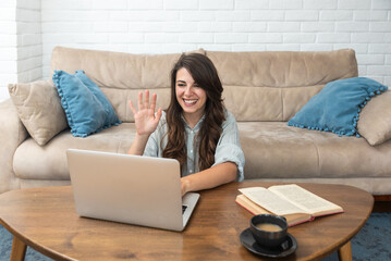 Young intelligent innovative businesswoman presenting her startup new business idea via video call...