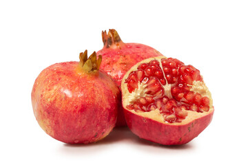 whole and hailf pomegranates isolated