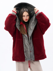 girl model in stylish clothes on a white background in the studio, fashion shooting.