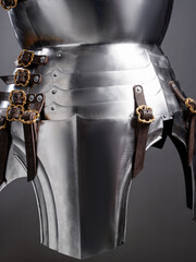 Shiny Medieval Steel Armor With Detailed Buckles and Leather Straps Close-Up..