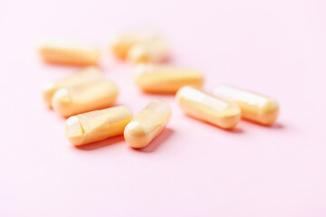 Coenzyme Q10 capsules. Antioxidants. Concept for a healthy dietary supplementation. Bright background. Soft focus. Close up. Copy space.	