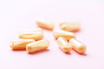 Coenzyme Q10 capsules. Antioxidants. Concept for a healthy dietary supplementation. Bright background. Soft focus. Close up. Copy space.	