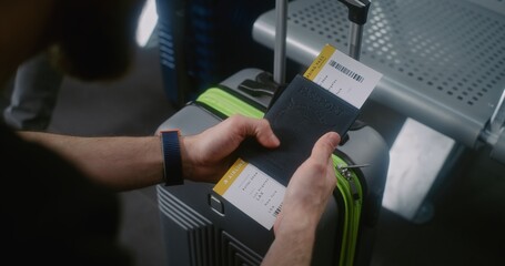 International Airport Terminal: Close Up of Passenger with Luggage Sitting in Departure Lounge of...