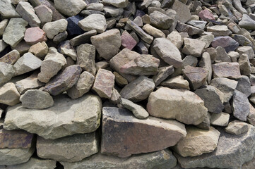 Close-up view of a pile of stones. Material suitable for use in construction. Background for various uses.