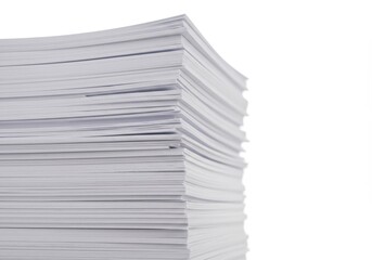 Stack of white paper sheets piled high against a blank background in a close-up shot