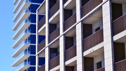 Modern new residential apartment house building complex. Exterior view of modern apartment building. New construction apartment or condo complex.