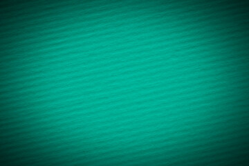 blank emerald color backdrop: close up of striped cardboard background with shadowed border
