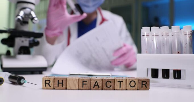A qualified medical professional conducts an examination of RH factor testing within a clinical laboratory setting