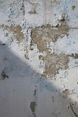 Soft light and shadows on simple textured walls.