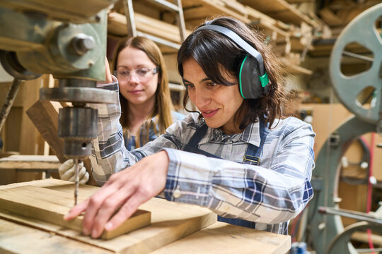 Team collaboration in woodworking training at a busy lumberyard