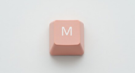 Single pink keyboard key M on white background