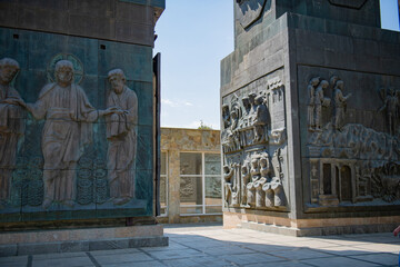 The columns depict historical and religious subjects