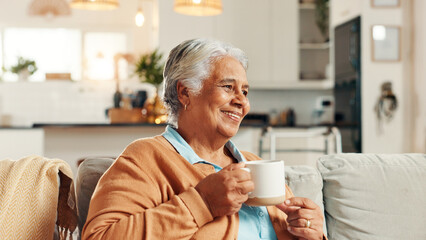 Elderly woman, thinking and smile with tea for relax, nostalgia and happy memories in home. Senior person, peace and warm drink on living room sofa with reflection, wellness and comfort in retirement