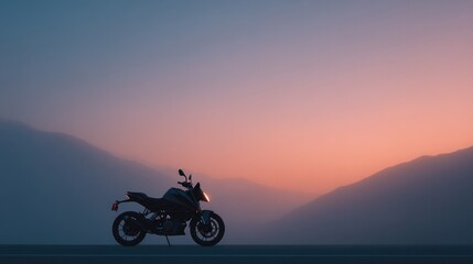 Obraz premium lone motorcycle stands on empty road shrouded in early morning mist offering minimalistic view