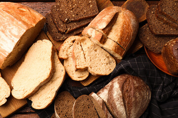 Different types of fresh bread on table, flat lay