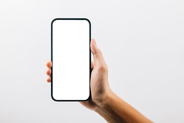 A hand holding a black cell phone isolated on white background, Man hand holding black smartphone mockup blank screen display, web site design application