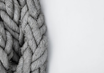 Thick braided textured twisted nautical rope isolated on white background.