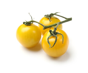 Ripe yellow cherry tomatoes isolated on white