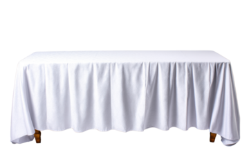 A rectangular wooden table is completely covered by a crisp white tablecloth gracefully draped with soft folds, against a plain white background providing isolation.