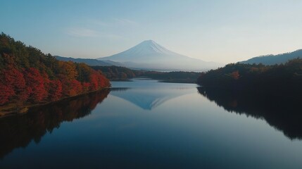 Mount Fuji serene landscape reflected in calm lake with autumn foliage, picturesque nature scenery, travel destination, outdoor adventure, Japan scenic view.