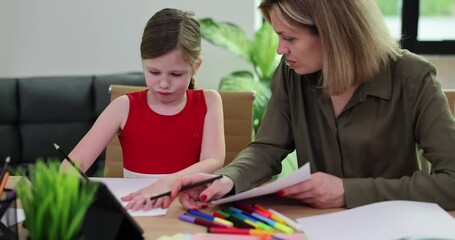 Mother and daughter sit at table using tablet and colorful markers. Joyful moments while drawing and nurturing creativity during quality time - Powered by Adobe