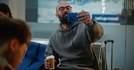 Crowded International Airport Terminal: Popular Travel Blogger Filming Video Content from Vacation...