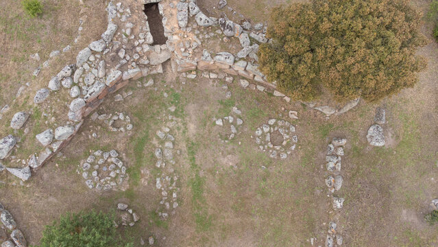 Drone shot of the prehistoric Giants' Tomb of San Cosimo, showcasing its megalithic layout
