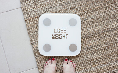 LOSE WEIGHT text written on digital scale screen. Weight loss concept. diet motivation background