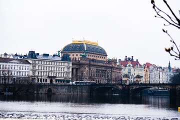 Naklejka premium Cityscape view of the city of Prague in the Czech Republic as seen from across the river Vltava.