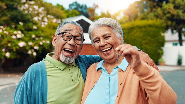 Excited, senior couple and key for new home, real estate investment and property mortgage. Loan, man and woman with keychain for moving, hug or relocation to dream neighborhood with portrait outdoor