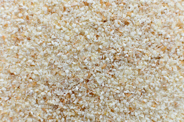 Close-up of raw semolina background in macro mode and soft focus. Top view.