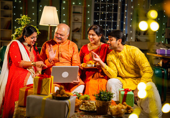 Celebrating Diwali and sharing wishes with loved ones using smartphone on a festive evening
