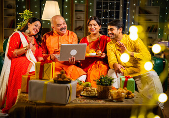 Celebrating Diwali and sharing wishes with loved ones using smartphone on a festive evening