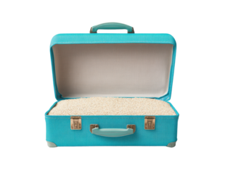 Vintage turquoise suitcase filled with rice for creative projects, cut out