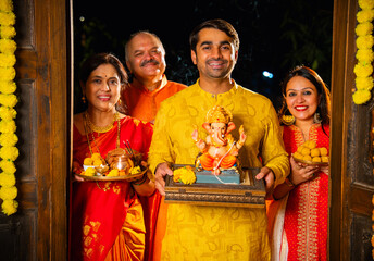 ndian joint family celebrates Ganesh Chaturthi by welcoming Ganpati idol at home entrance