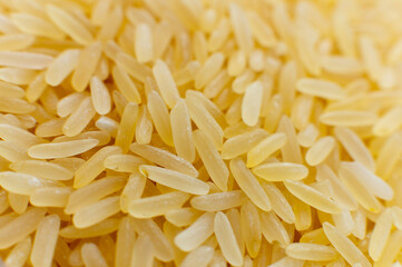 Macro close-up of brown rice in soft focus. Side view.