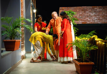 Greeting guests for Diwali night, Indian parents welcome son and wife with joy and tradition