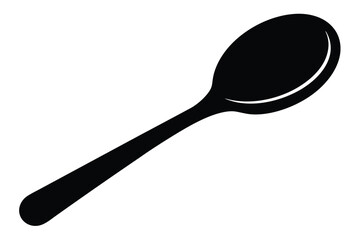 A simple black spoon lies diagonally across the frame, ready for use in cooking