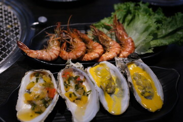 Stir fried shrimp and squid on white dish. delicious Oysters shrimp 
