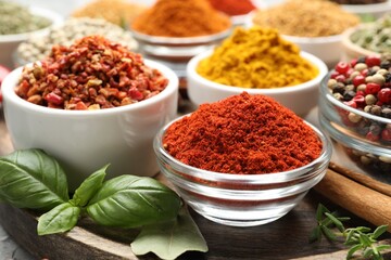 Many different aromatic spices on table, closeup