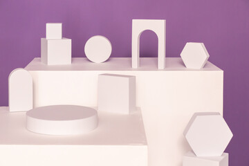 Contemporary Abstract White Geometric Shapes pedestal Set Against a Vibrant Purple Background. High...