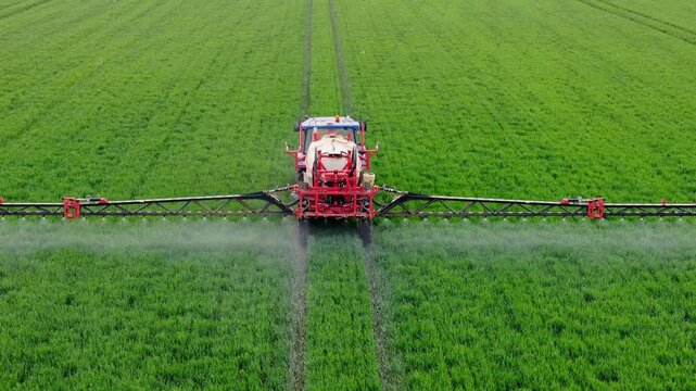 Precision Farming Technology in Action. Drone View of Crop Spraying