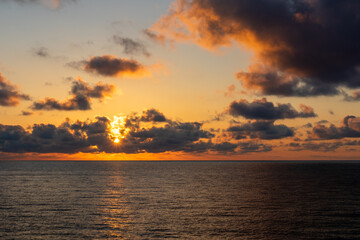 Fototapeta premium Dreamlike sunrise Cala Romantica Mallorca Spain with beautiful red clouds 