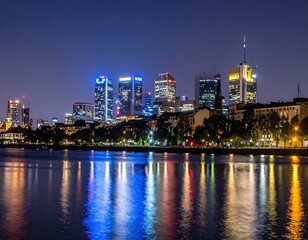 Obraz premium Night view of Frankfurt skyline reflected in the Main river.