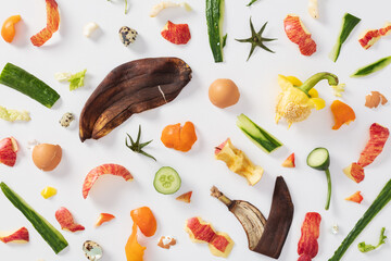 Scattered organic food waste for compost on white background
