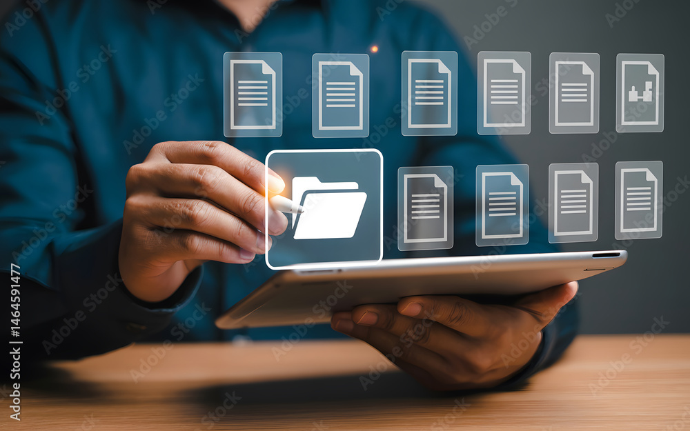 Aufkleber businessman using a tablet to organize digital files and manage documents in a cloud system