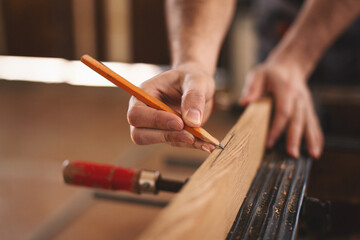 Young carpenter working in his workshop