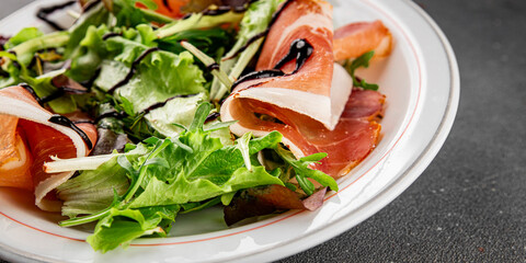 Salad jamon meat green leaf lettuce appetizer natural food fresh delicious gourmet food background on the table rustic food top view copy space keto and paleo diet
